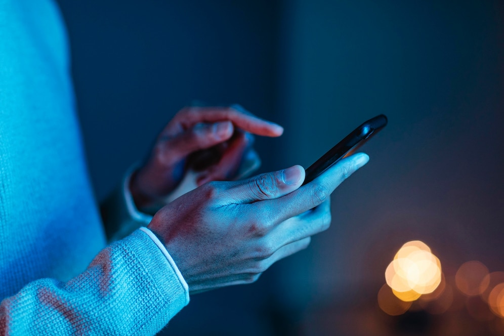 side view man using smartphone 23 2148793481